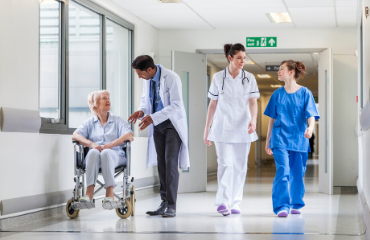 Medical staff walking through a hospital corridor 