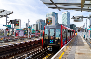 train pulling up to a platform