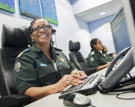 Ambulance call centre lady typing on a keyboard