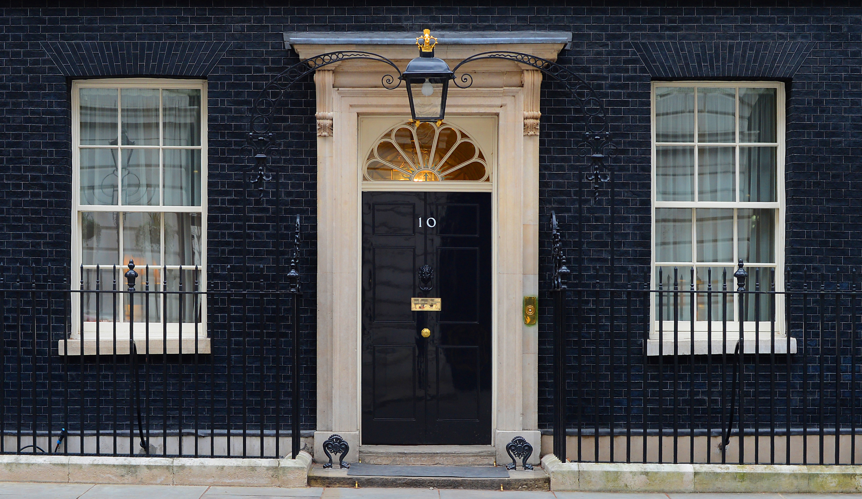 black door with number ten on it on downing street