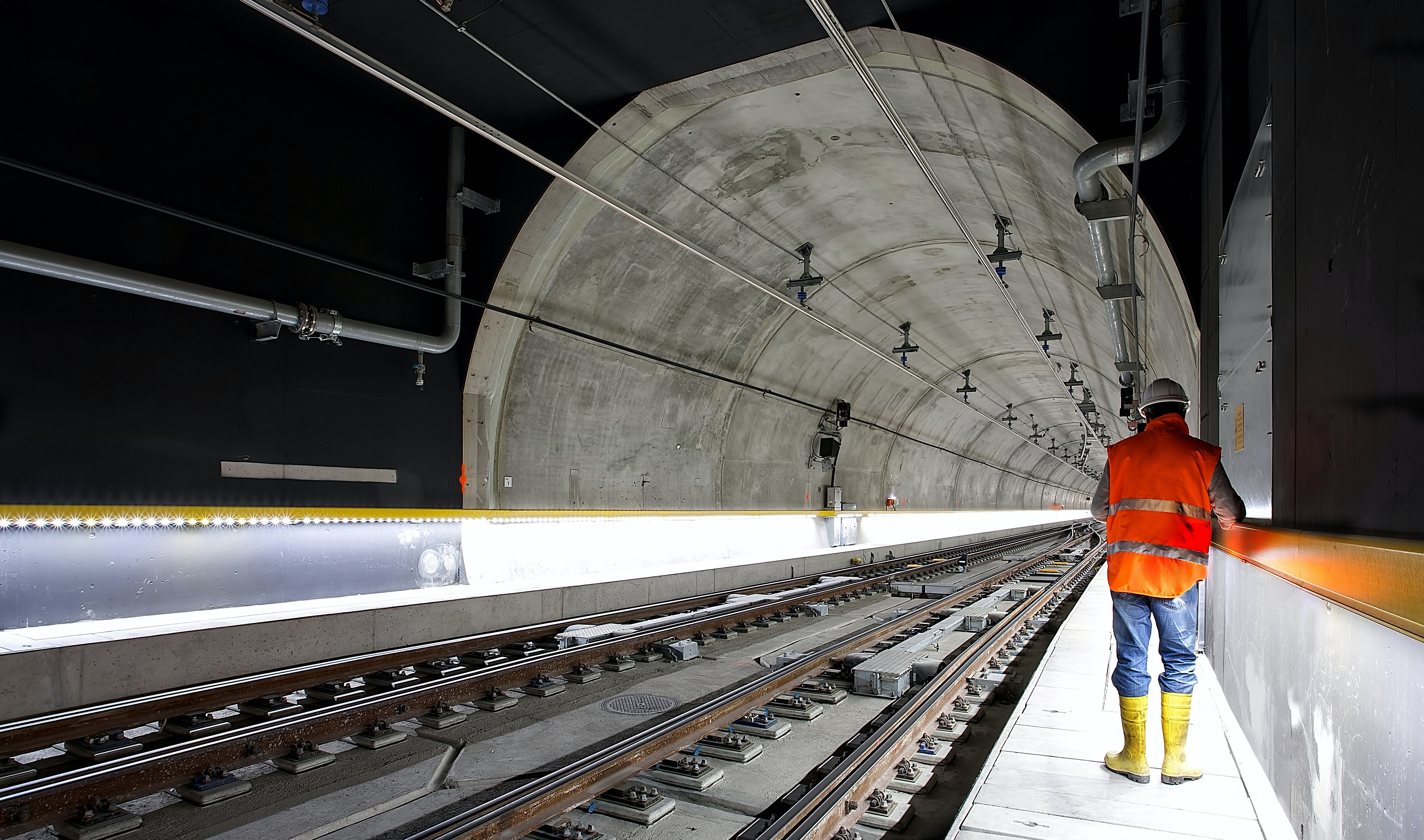 A man working in an under ground train tunnel