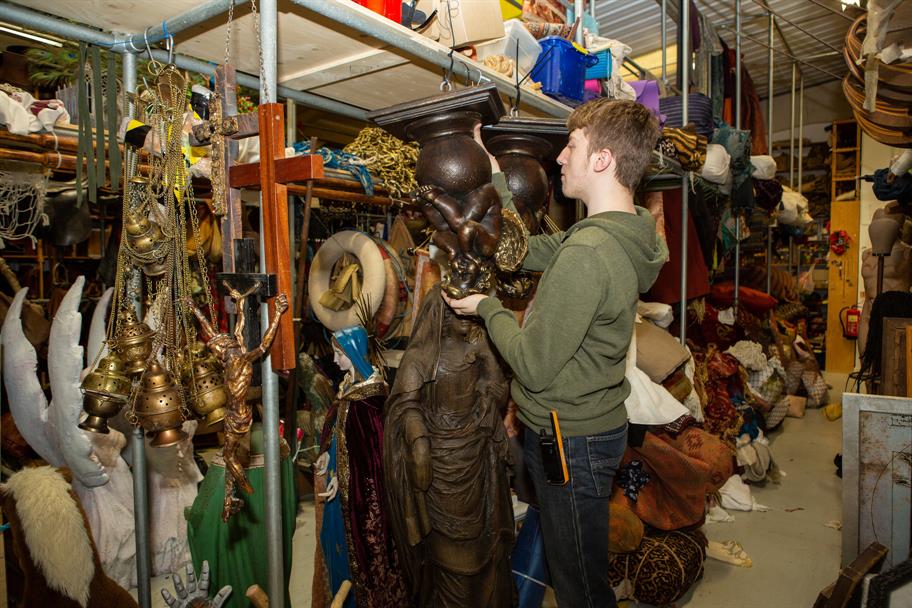 Man in a theatre prop room