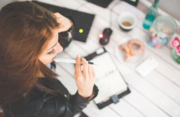 Lady chewing a pen 