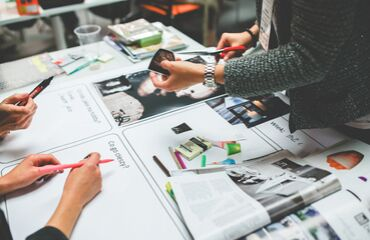 Workshop taking place with workshop materials on table