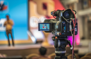 Camera filming a speech