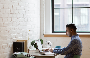 Man working on a laptop at a desk