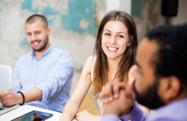 lady smiling at a man sat at a table