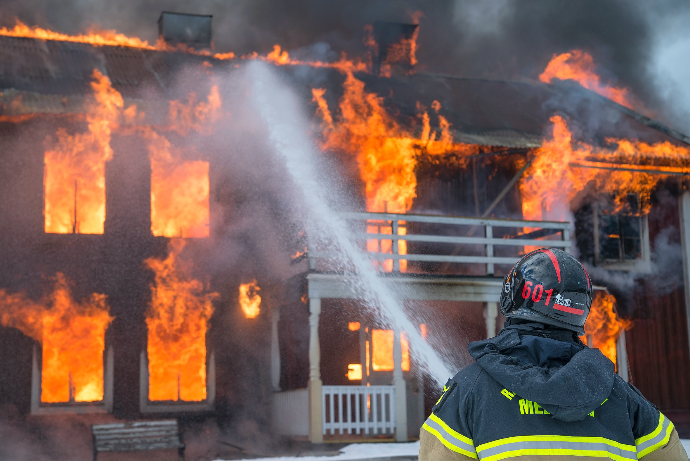 Fireman putting out a house fire