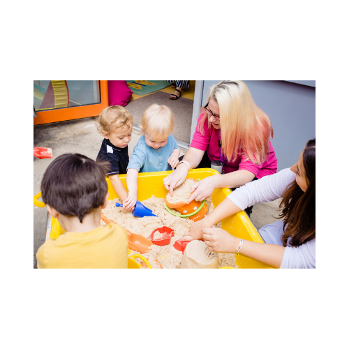 Family playing with sand in nursery setting