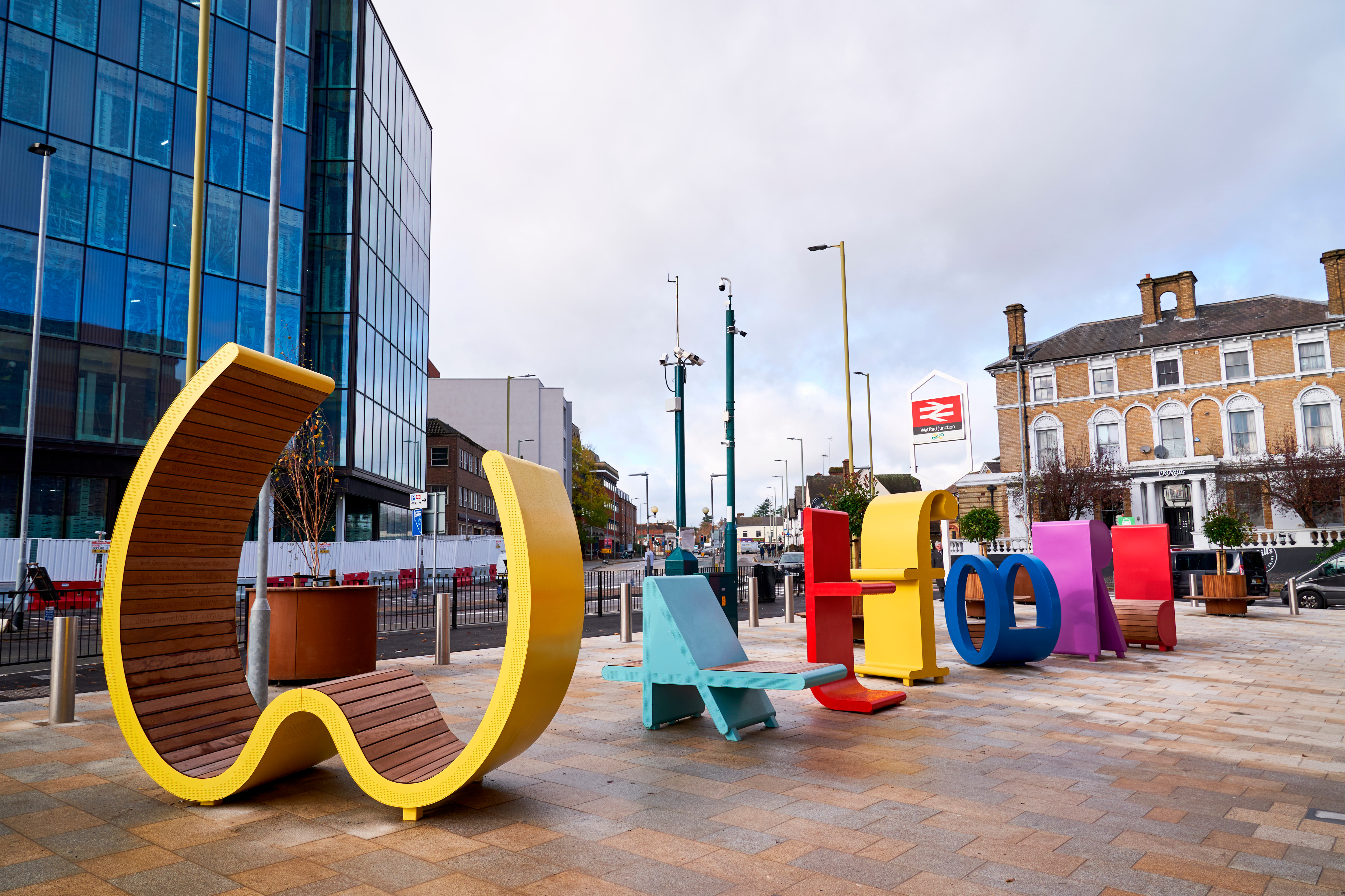 Colourful letters sculpture and seating in Watford Junction